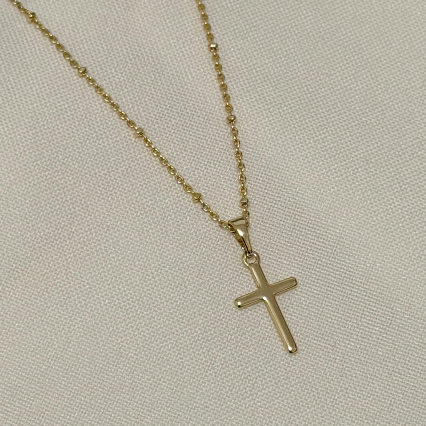 gold filled minimalisti cross necklace with a dainty chain 