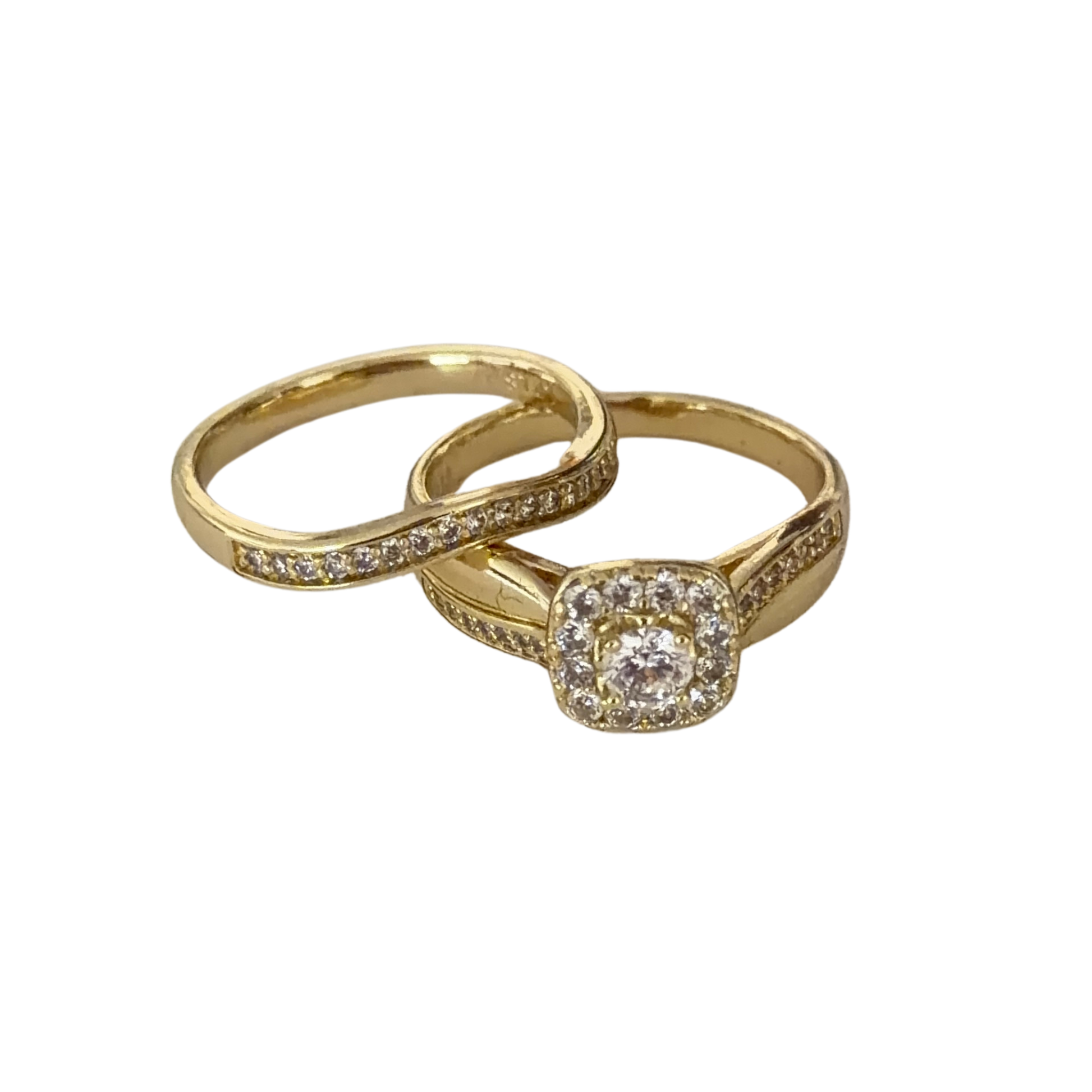 A pair of gold rings, one featuring a square halo-cut clear gemstone and the other a slim band with small pavé-set clear stones, displayed on a clean white background.